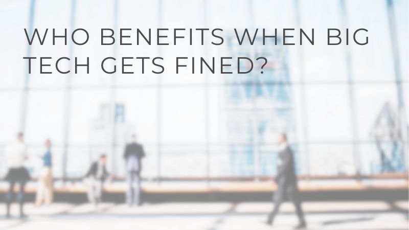 Blurred image of people in a modern office building lobby with the question "WHO BENEFITS WHEN BIG TECH GETS FINED?" superimposed.